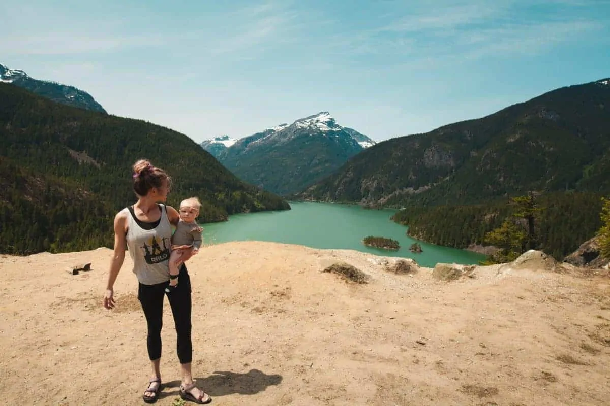 woman and baby by the lake